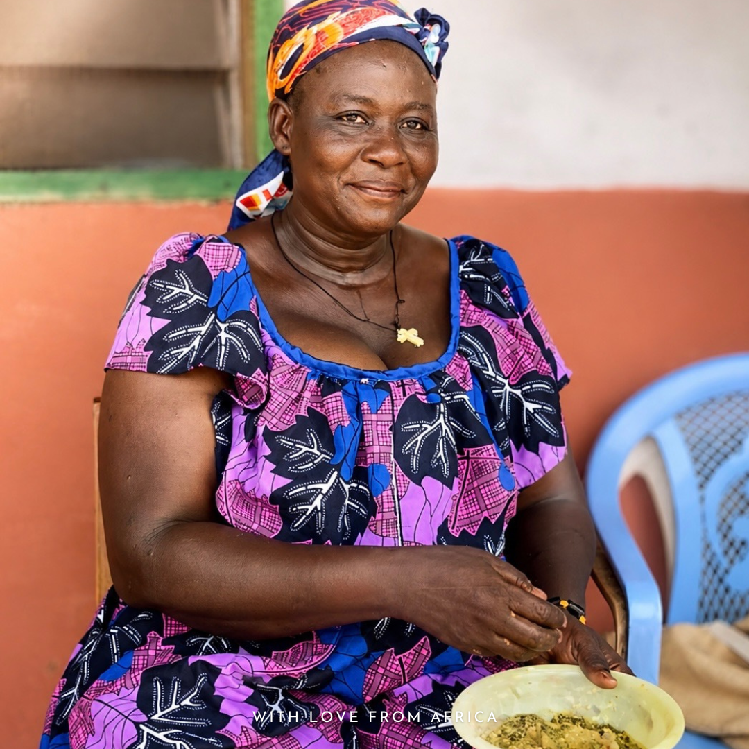 FairTale GHANA manager Susana is eating fresh raw Shea butter from a bowl 