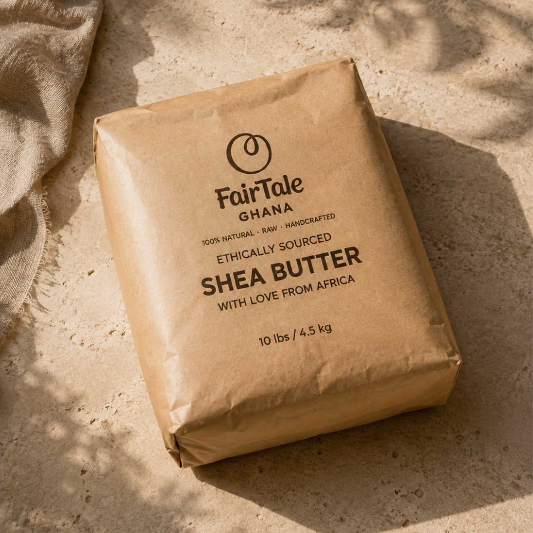A 10 lb kraft paper bag of FairTale Ghana Shea Butter, photographed on a textured stone surface with natural dappled sunlight and shadows.