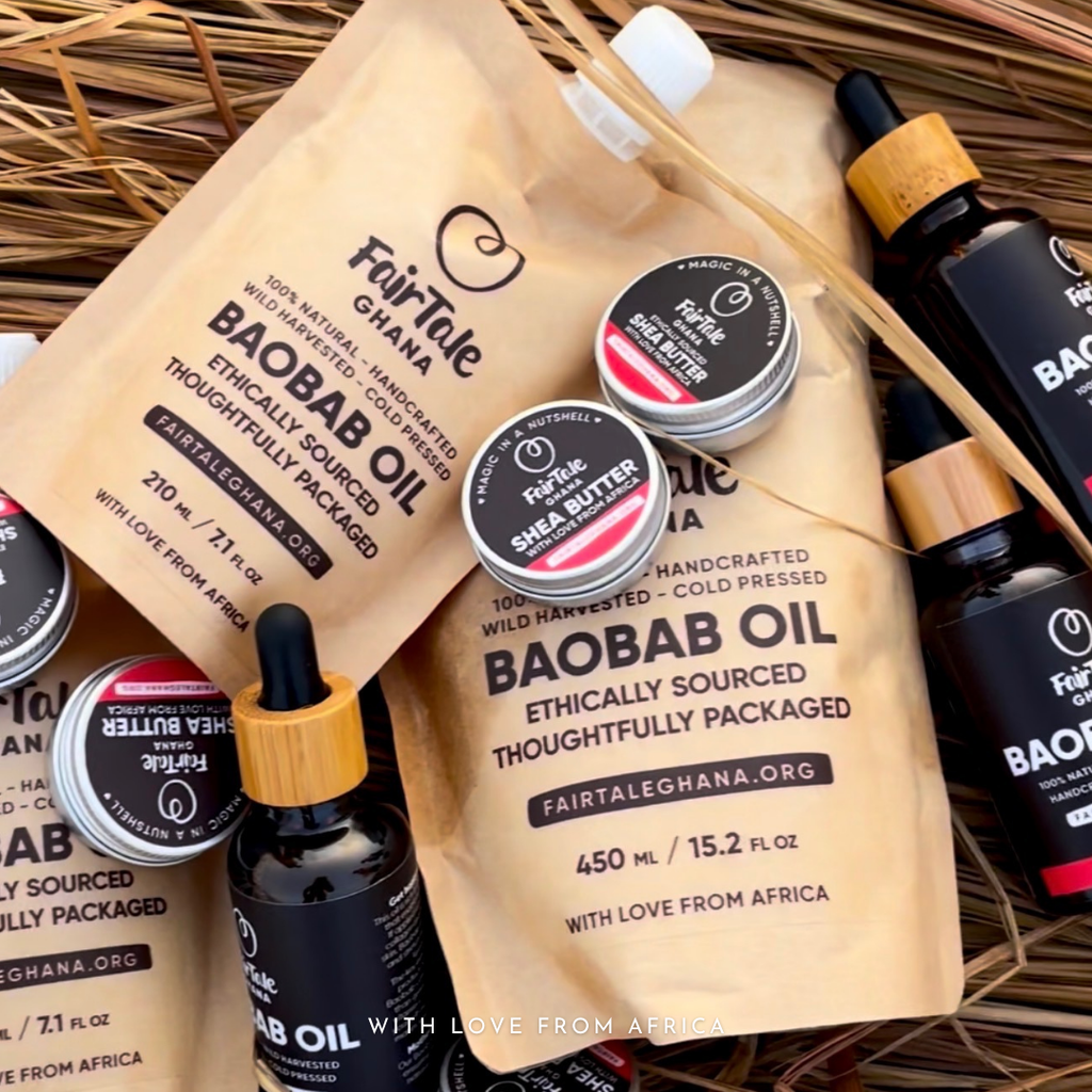 Flat lay of FairTale GHANA Baobab oil pouches, Shea butter tins and a dropper bottle on raffia