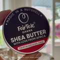 Graphic showing Shea butter decanted into FairTale GHANA's empty metal tin.